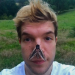 Photo of Douglas Boyes with a moth on his nose