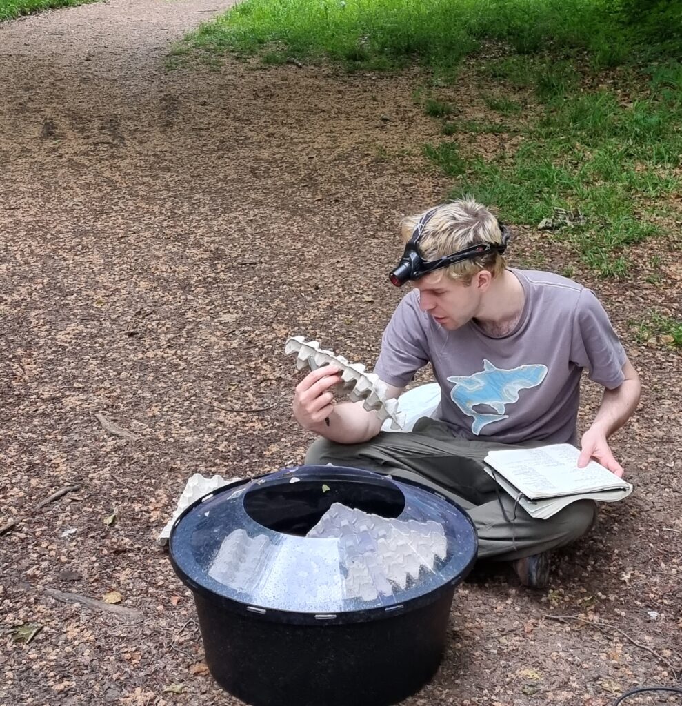 Photo of Douglas Boyes with entomology equipment conducting biological recording