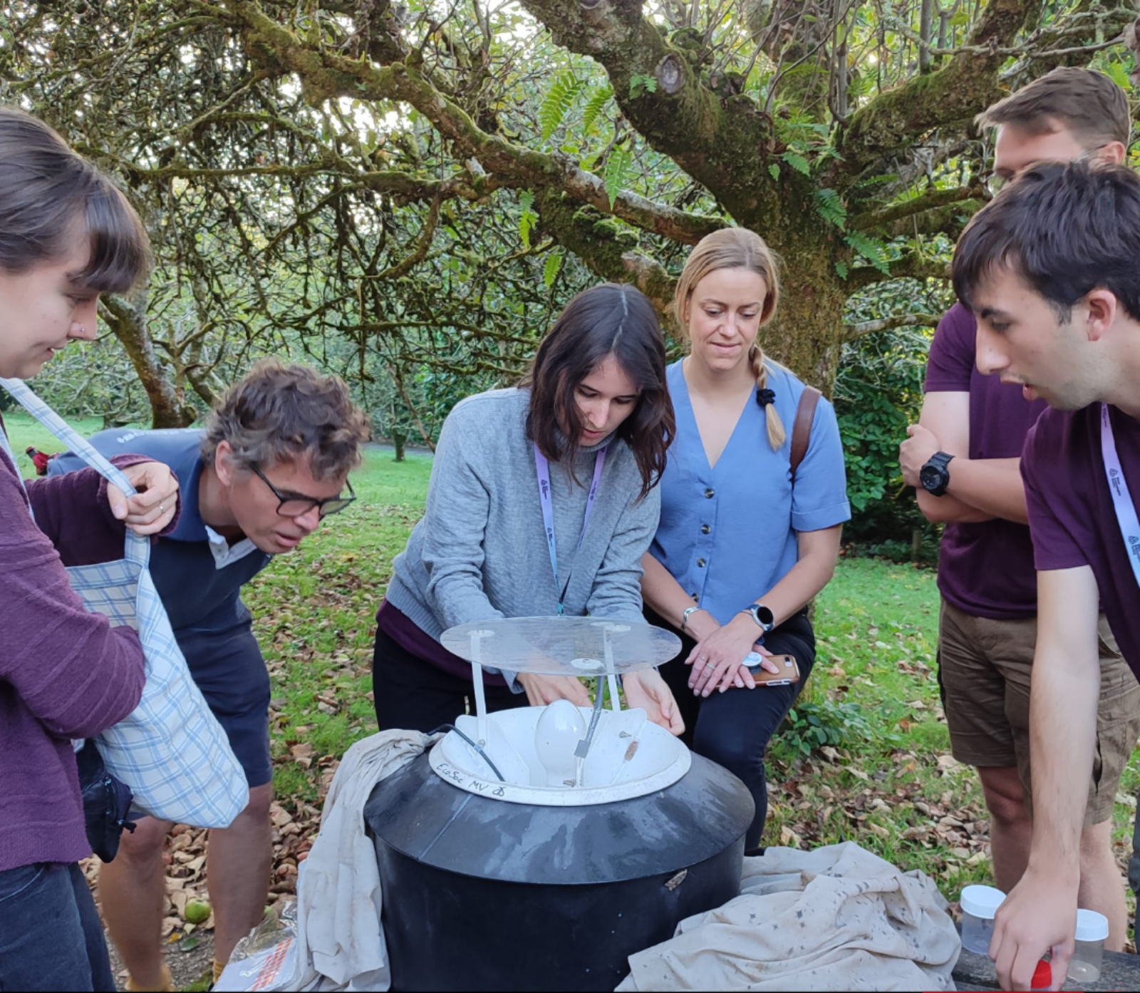 Group of people at a RES event conducting research through moth trapping.