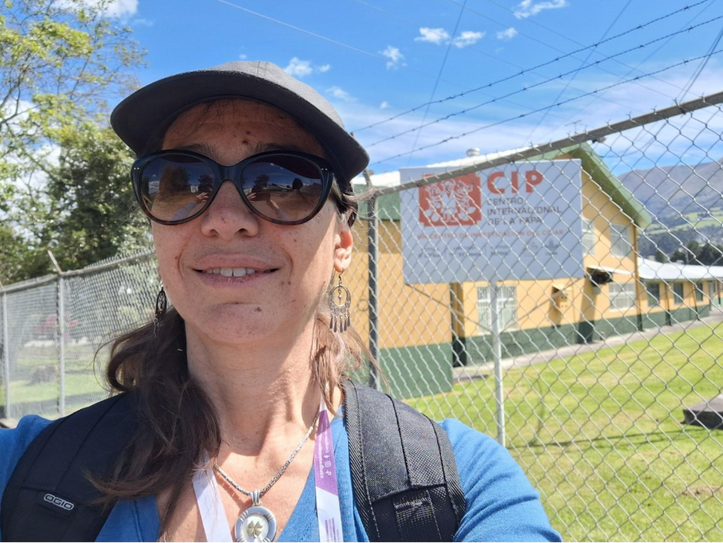 Cecilia on a trip to Ecuador for the Latin American Potato Congress in front of the CIP (Centro Internacional de la Papa) lab 