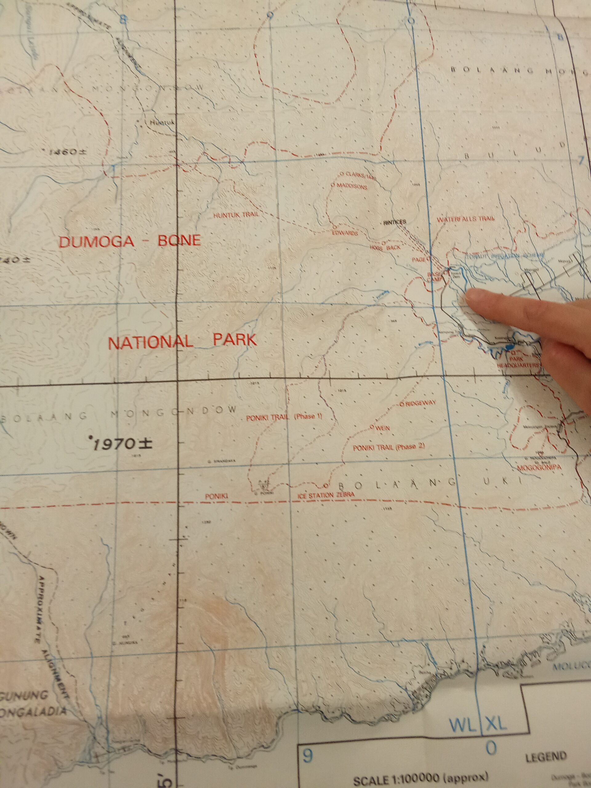 A hand pointing on a map of Indonesia relating to Project Wallace
