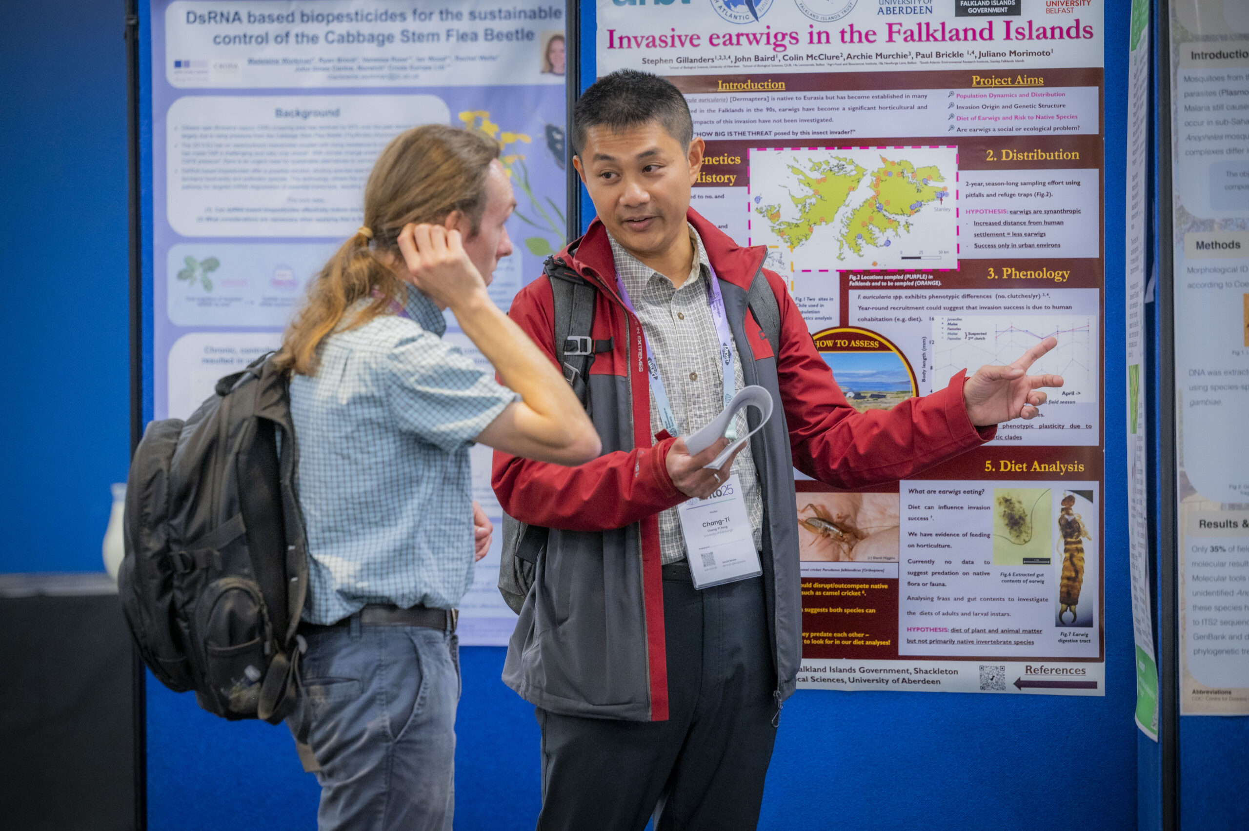 Delegates at a poster presentation at Ento25