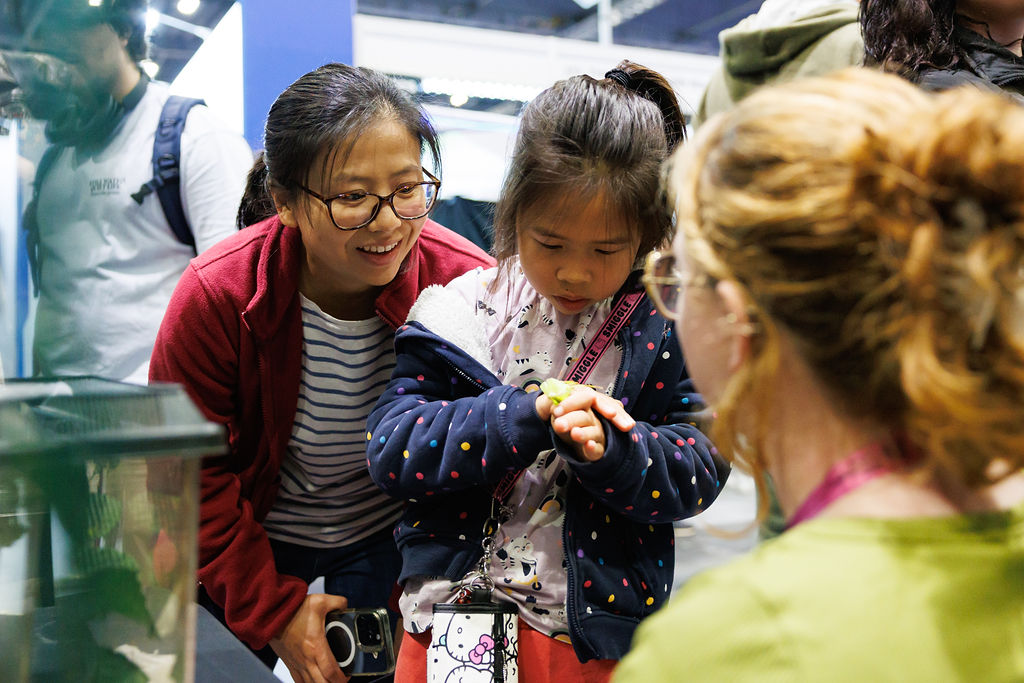 Child holding an insect at New Scientist 2025 Photo (c) Alistair Veryard Photography 