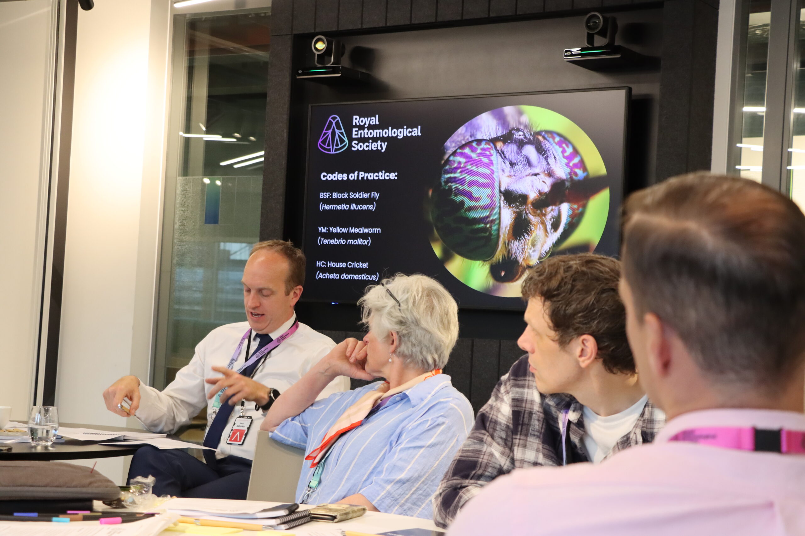 RES CEO Simon Ward chatting with delegates at a roundtable event discussing insect welfare codes of practice
