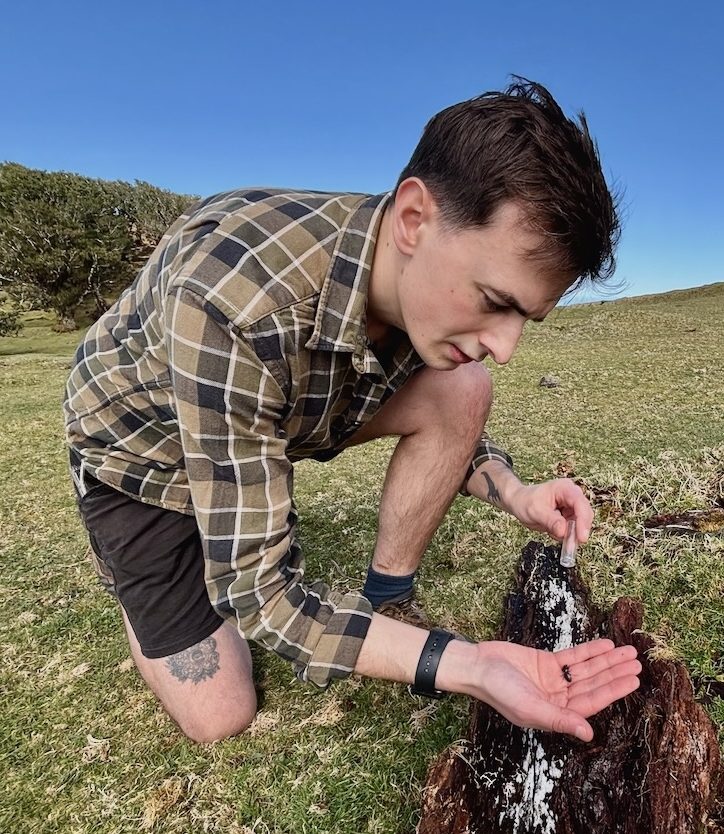 Connor Butler holding a beetle